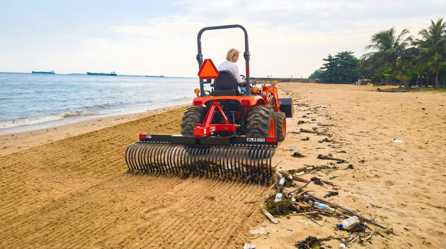 Landscape rake raking debris from high tide