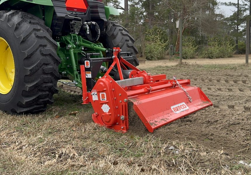 Rotary tiller tilling ground for vegetable garden